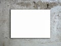 A white blank rectangle picture frame or empty square artist canvas space hanging on grunge concrete wall.