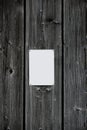 White blank sheet on wooden wall Royalty Free Stock Photo