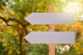 White blank signs pointing in same directions nature back ground Royalty Free Stock Photo