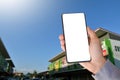 White blank touch screen smartphone holding in hand Royalty Free Stock Photo