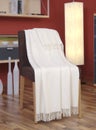 White blanket draped over a chair