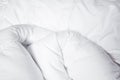 White blanket. Wrinkle messy blanket in bedroom after waking up in the morning. Bed details. Duvet and blanket, an unmade bed Royalty Free Stock Photo