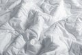 White blanket. Wrinkle messy blanket in bedroom after waking up in the morning. Bed details. Royalty Free Stock Photo