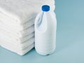 Laundry launderer bleach bottles and terry towel Royalty Free Stock Photo