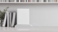 White Bleached Bookshelf and Empty White Book with Blank Cover