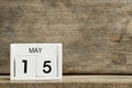 White block calendar present date 15 and month May on wood background Royalty Free Stock Photo