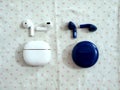 White and Blue AirPod On Table Royalty Free Stock Photo