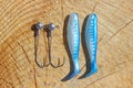 White blue artificial bait and Fishing hook. Royalty Free Stock Photo