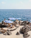 White and blue beach umbrellas in Capri Royalty Free Stock Photo