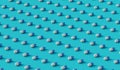 White and blue capsules neatly arranged in diagonal lines on blue background, 3d illustration