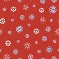 White and blue Christmas snowflakes on red background seamless pattern. Royalty Free Stock Photo