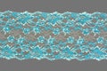 Color straight strip of lace fabric on a gray background. Elastic silk nylon braid border. use for clothes and linen decoration Royalty Free Stock Photo