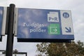 White and blue direction sign to Zuidplaspolder on the platform of train station Nieuwerkerk aan den IJssel