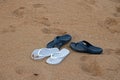 WHITE AND BLUE FLIPFLOPS ON THE BEACH Royalty Free Stock Photo