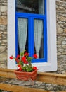 White and Blue Framed Window on Stone House, Greece