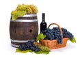 White and blue grape in basket with barrel Royalty Free Stock Photo