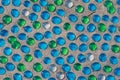 White, blue and green glass beads on sand Royalty Free Stock Photo