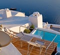 white and blue house in santorini pool