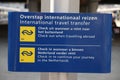 White and blue information sign at platform for transfer to internationa trains at Utrecht central station Royalty Free Stock Photo