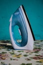 White blue ironer placed standing on a table Royalty Free Stock Photo