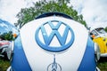 The white and blue logo and the Volkswagen Transporter front view Royalty Free Stock Photo