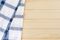 White and blue napkin on wooden table Royalty Free Stock Photo