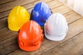 White, blue, orange, yellow hard safety helmet construction hat Royalty Free Stock Photo