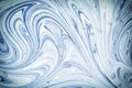 White and blue paint mixed up creating a beautiful abstract pattern. Blank background for layouts. Royalty Free Stock Photo