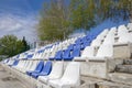 White and blue plastic empty stadium seats in arena Royalty Free Stock Photo