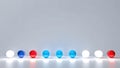 White, blue and red lamps on a white background. Arranged in a row on a white table. Some light bulbs are glowing Royalty Free Stock Photo