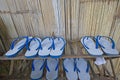 White and blue sandals on wooden shelves Royalty Free Stock Photo