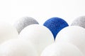 White, blue and silver Christmas balls on a light background, the concept of celebration and joy Royalty Free Stock Photo