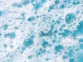 White and blue soap foam. Lather with bubbles. Laundry cleaning or sea wave background