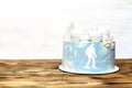 sponge vanilla creamy frosting cake with big round marshmallow, chocolate snowflakes,skier picture