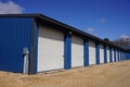 White and Blue storage units being used by the community Royalty Free Stock Photo