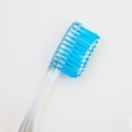 White blue toothbrush on a white background, close-up medical abstract background Royalty Free Stock Photo