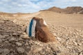 White-blue  way sign in the mountains of the Judean Desert near the Tamarim stream on the Israeli side of the Dead Sea near Royalty Free Stock Photo