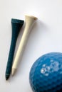 White and blue wooden tee - golf ball on foregroun Royalty Free Stock Photo
