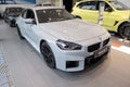 white BMW M2 all-electric car German manufacturer BMW AG, Powerful electric motor, Advanced technology in automotive industry,