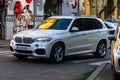 White BMW x5 car in motion on asphalt road, side view of car on street. Bucharest, Romania, 2020 Royalty Free Stock Photo
