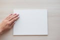 White board with hands for copy space. School office supplies on wooden background. Back to school concept. Top view Royalty Free Stock Photo