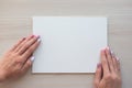 White board with hands for copy space. School office supplies on wooden background. Back to school concept. Top view ready for Royalty Free Stock Photo