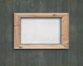 White board with wooden frame on old green wood wall Royalty Free Stock Photo