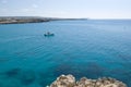 White boat and blue sea near coast in Cyprus Royalty Free Stock Photo