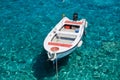 White boat at crystal clear blue water of Marmara beach, near Aradena gorge, island of Crete Royalty Free Stock Photo