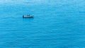 A white boat isolated in the middle of the blue sea Royalty Free Stock Photo