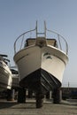 White boat on repairing dock Royalty Free Stock Photo