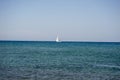 White boat sailing in the open blue aegean sea Royalty Free Stock Photo