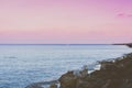 A white boat sails on the horizon along the calm surface of the water. Seascape