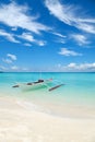 White boat on a tropical beach Royalty Free Stock Photo